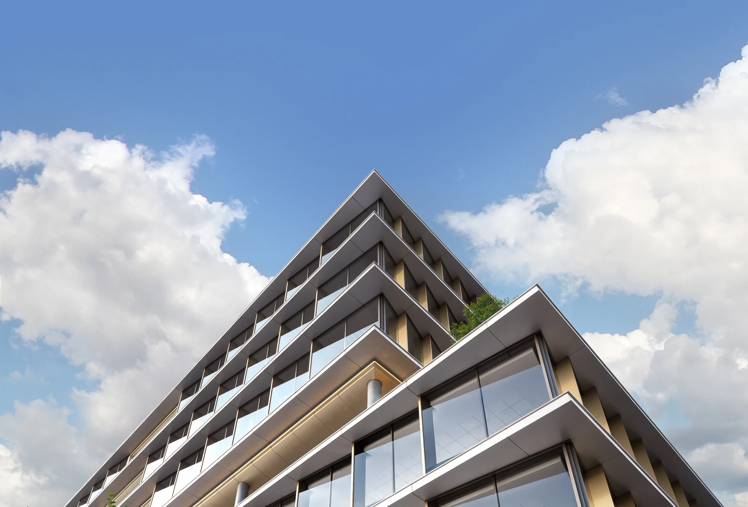 Upward angle of The ARC corner facade with striking lines and mirrored glass under cloudy sky