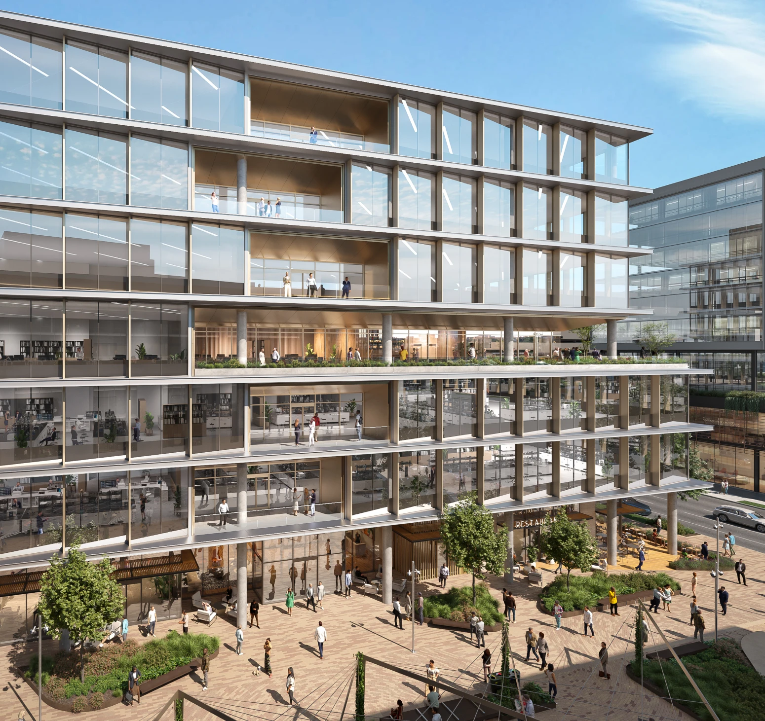 Exterior view of The Arc office building with glass facade and landscaped public plaza