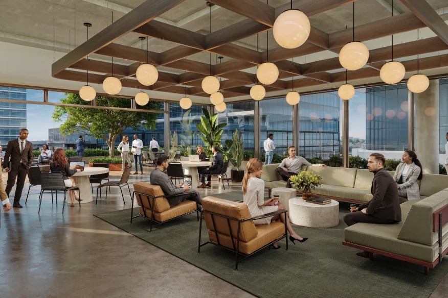 Stylish corporate lounge with professionals seated in conversation under modern globe lighting