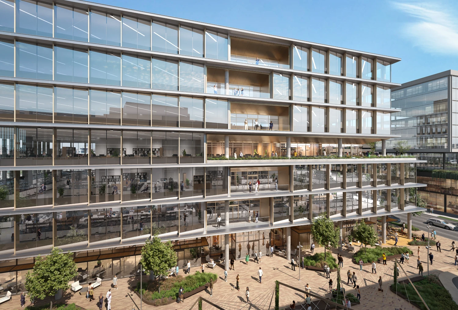 Front-facing view of The ARC building with glass facade and active plaza filled with people